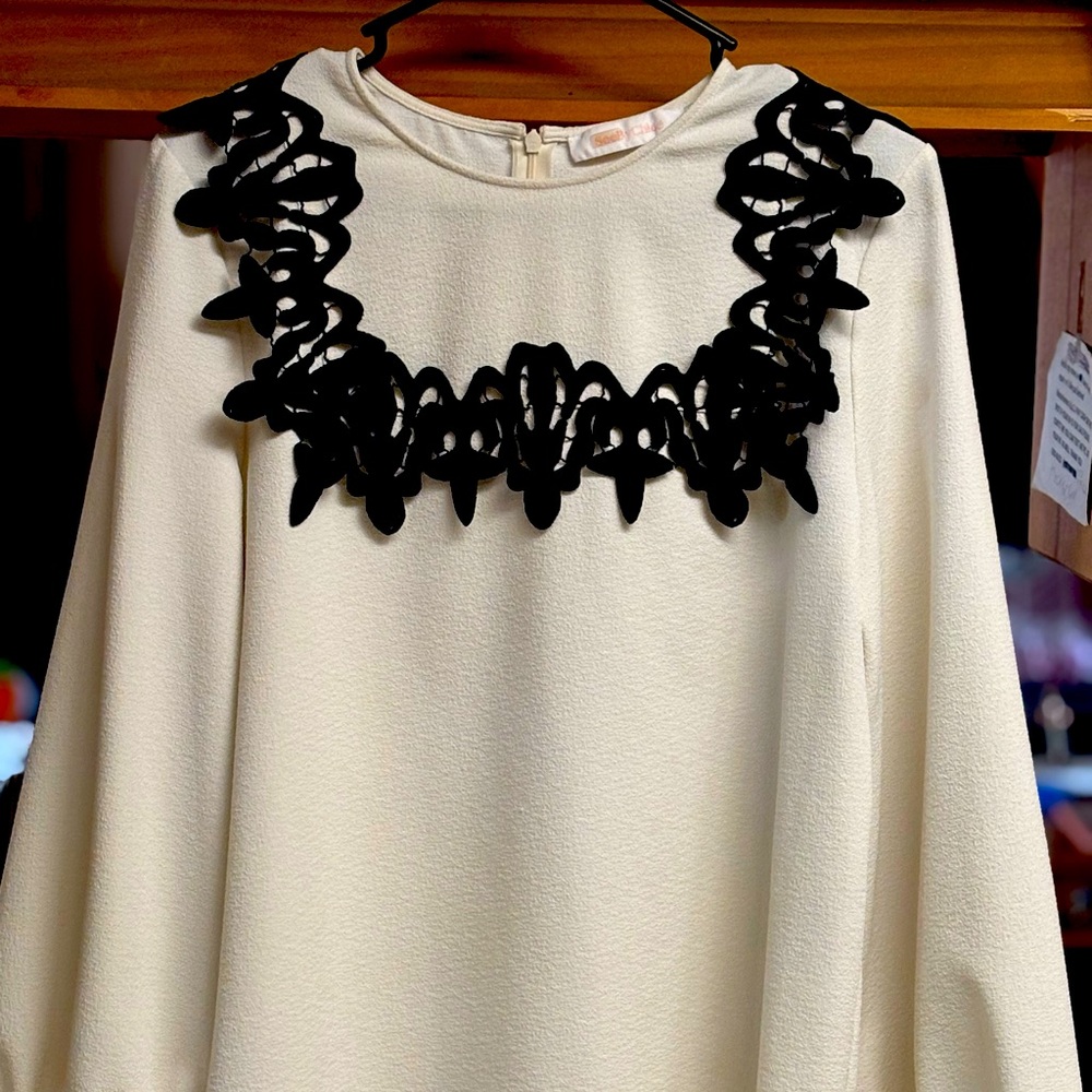 Elegant Cream Blouse with Black Lace Detail